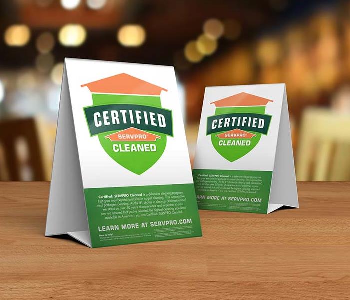 Certified: SERVPRO Cleaned table toppers on table inside business