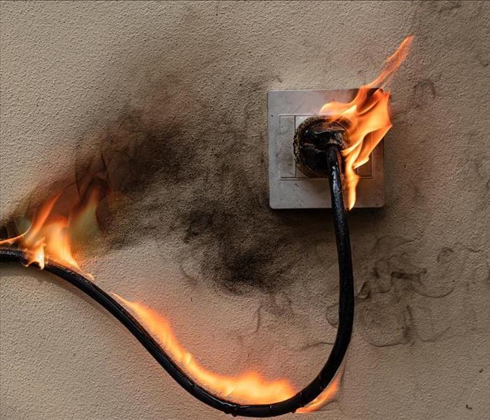 Electrical plug on fire.